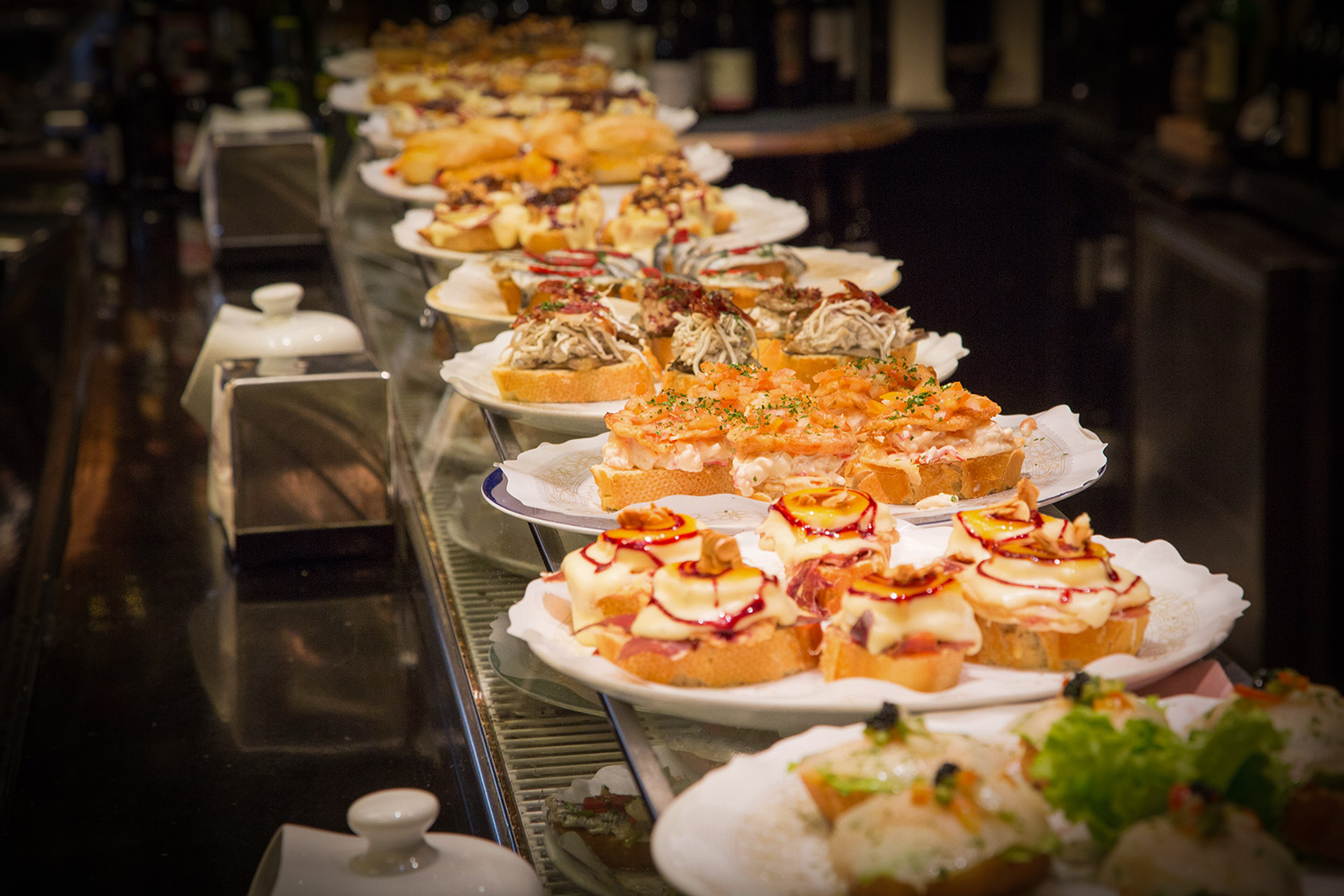 At Plaza Nueva in Bilbao's Old Town, you can hop from bar to bar and sample pintxos.