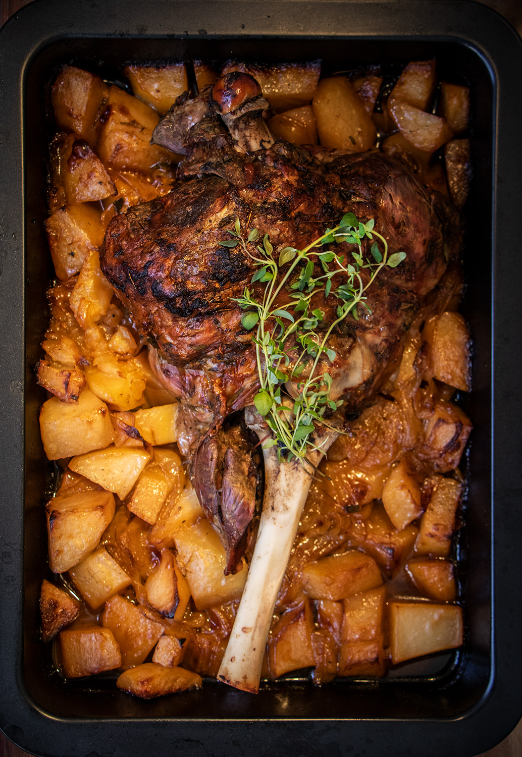 Long roast lamb with potatoes and onions