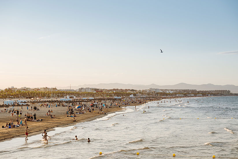 Take a dip in the waves on the beach in Valencia's El Cabanyal neighborhood.